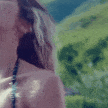 a close up of a woman 's back with a blurry background