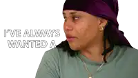 a woman wearing a purple head scarf and a necklace says i 've always wanted a