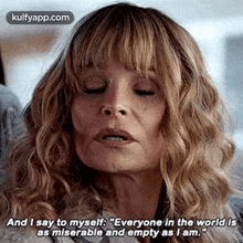a close up of a woman 's face with her eyes closed and a quote on her face .