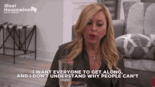 a real housewives advertisement shows a woman sitting at a table with a glass of champagne