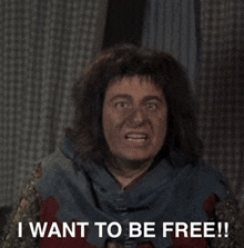 a man says i want to be free in front of a checkered background