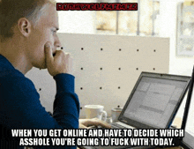 a man is sitting in front of a laptop computer with a darkwolfmemes meme above him