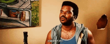 a man is standing in front of a painting and says i seen it