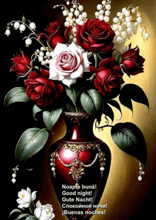 a red vase filled with red and white roses