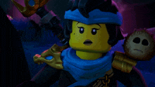 a lego character with a blue scarf around his head