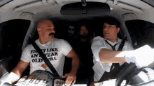 a man wearing a white shirt that says fight like an year old girl