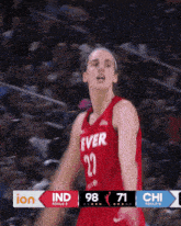 a basketball player wearing a red jersey that says ever