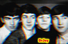 a group of men are posing for a picture and one of them is wearing a shirt that says dr joy