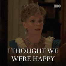a woman wearing a tiara and necklace says i thought we were happy