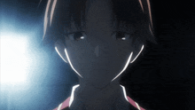 a close up of a boy 's face with a light shining on it