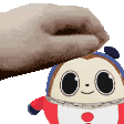 a person is petting a stuffed animal with a towel on it 's head .