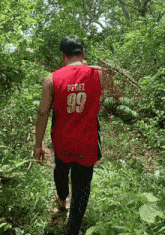 a man wearing a red jersey with the number 99 on it