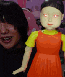 a doll with red eyes is next to a woman with piercings