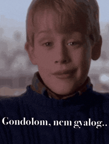 a close up of a child 's face with the words condolom nem gyalog