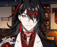 a close up of a person 's face with black hair and red streaks