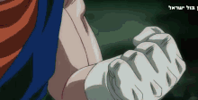 a close up of a person 's fist with a foreign language written in the corner
