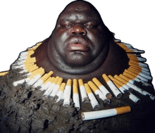 a man with a necklace of cigarettes around his neck looks at the camera