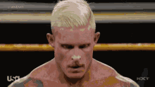 a man in a wrestling ring with usa next on the bottom right