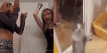 two women are dancing in front of a white board