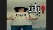 a man wearing a white shirt that says get real gng