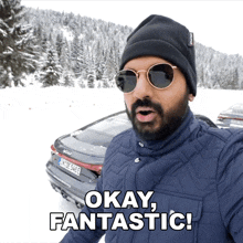 a man wearing sunglasses and a hat says " okay fantastic "