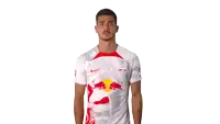 a man wearing a white shirt with a red bull on the front