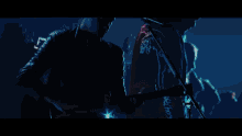 a blurry picture of a person in a dark room with a blue background