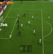 a soccer game is being played on a field that has the word tok on it