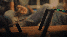 a person laying on a couch with their feet on a table