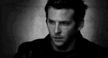 a black and white photo of a man 's face .