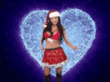 a woman in a santa outfit is dancing in front of a heart made of snowflakes