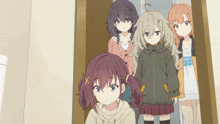 a group of anime girls are standing in a line