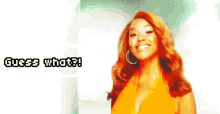 a woman with red hair is smiling and says guess what
