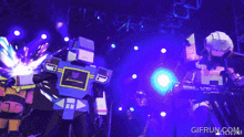 a gif from gifrun.com shows a group of robots on a stage