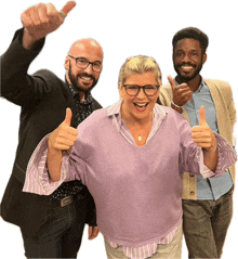 a woman in a purple sweater is giving two thumbs up