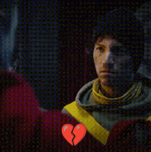 a man with a broken heart in front of his face