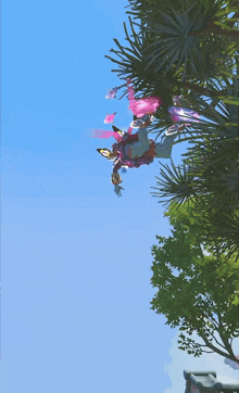 a woman in a pink and blue dress is standing on a grassy field
