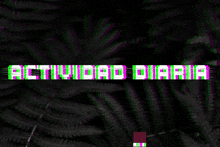 the word actividad is on a dark background with ferns