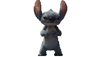 a stuffed animal is standing on its hind legs and looking at the camera