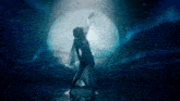a woman in a white dress is dancing in front of a large moon