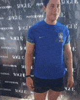 a man wearing a blue shirt that says brasil on the front
