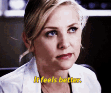 a woman in a white lab coat says " it feels better "