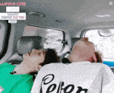 two men laying in the back seat of a car with wanna one written on the bottom left