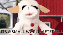 a stuffed animal with the words " it 's a small world after all " on the bottom