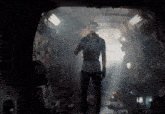 a man is wearing a virtual reality headset in a dark room