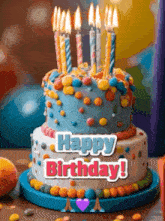 a birthday cake with candles on it and the words `` happy birthday '' on it