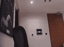 a room with a picture on the wall that says " twist "