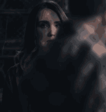 a close up of a woman 's face with smoke coming out of her mouth