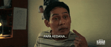 a man in a striped shirt says papa kedana in a foreign language