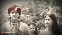 a black and white photo of a boy and two girls with the words sony television on the bottom